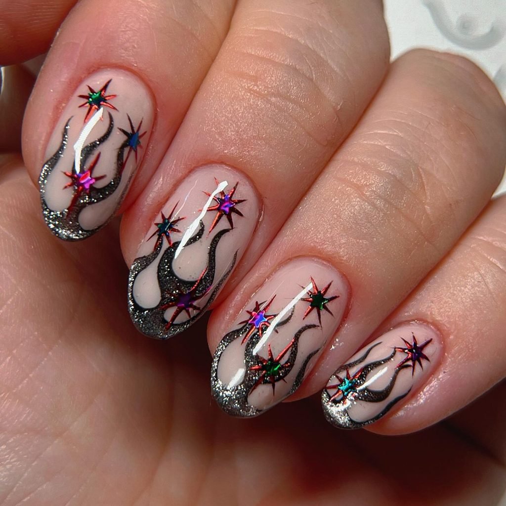 Nail art with multicolored stars and black flame design on glossy nails. Creative and vibrant manicure style.