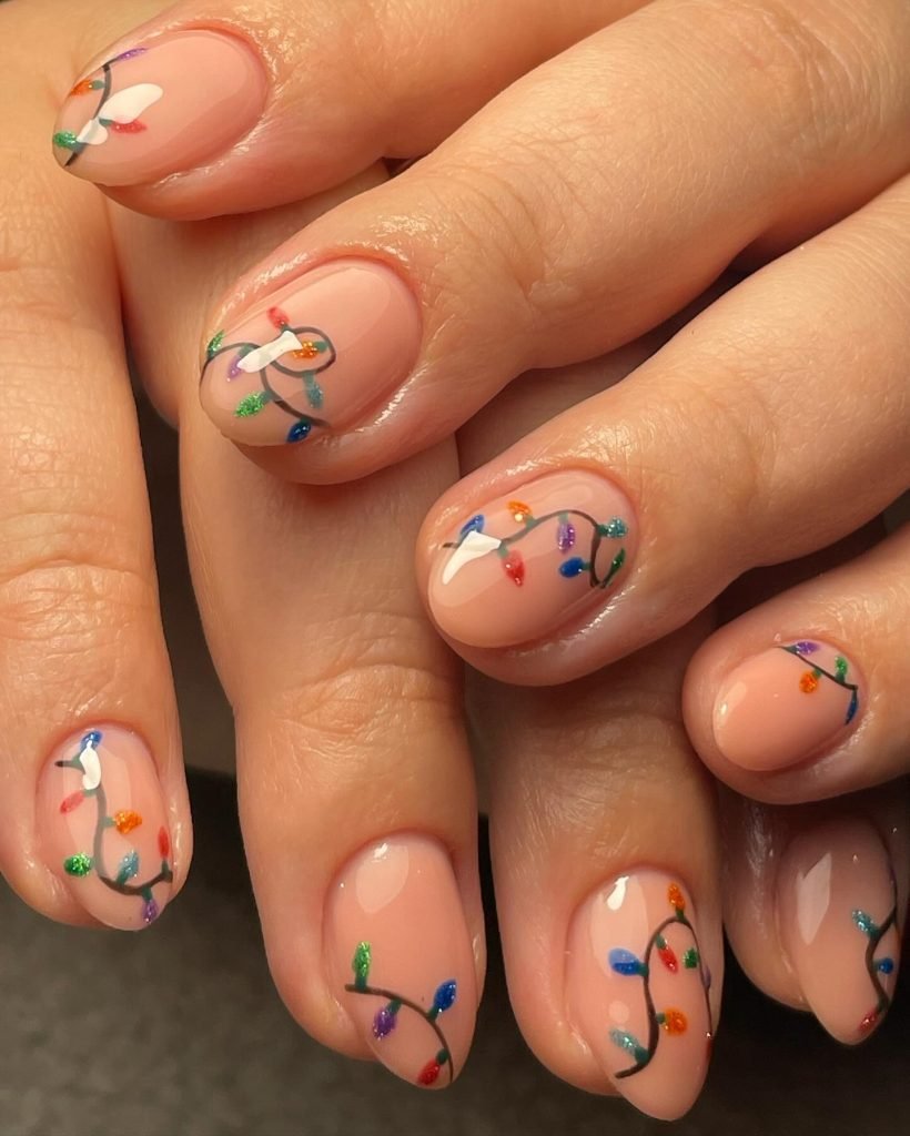 Colorful Christmas light nail art on almond-shaped nails, festive manicure design on natural nude base.
