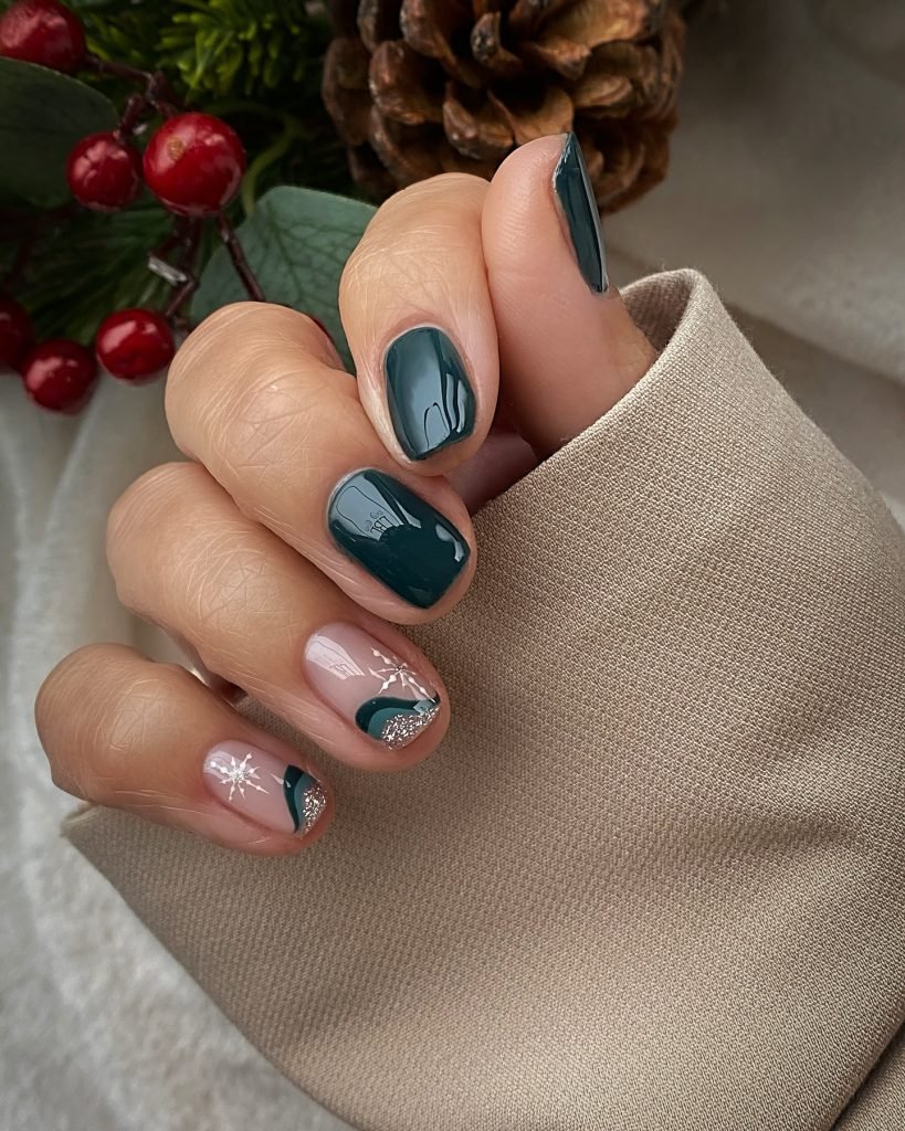 Stylish green and nude nail art with festive white and silver accents, perfect for a chic holiday manicure.