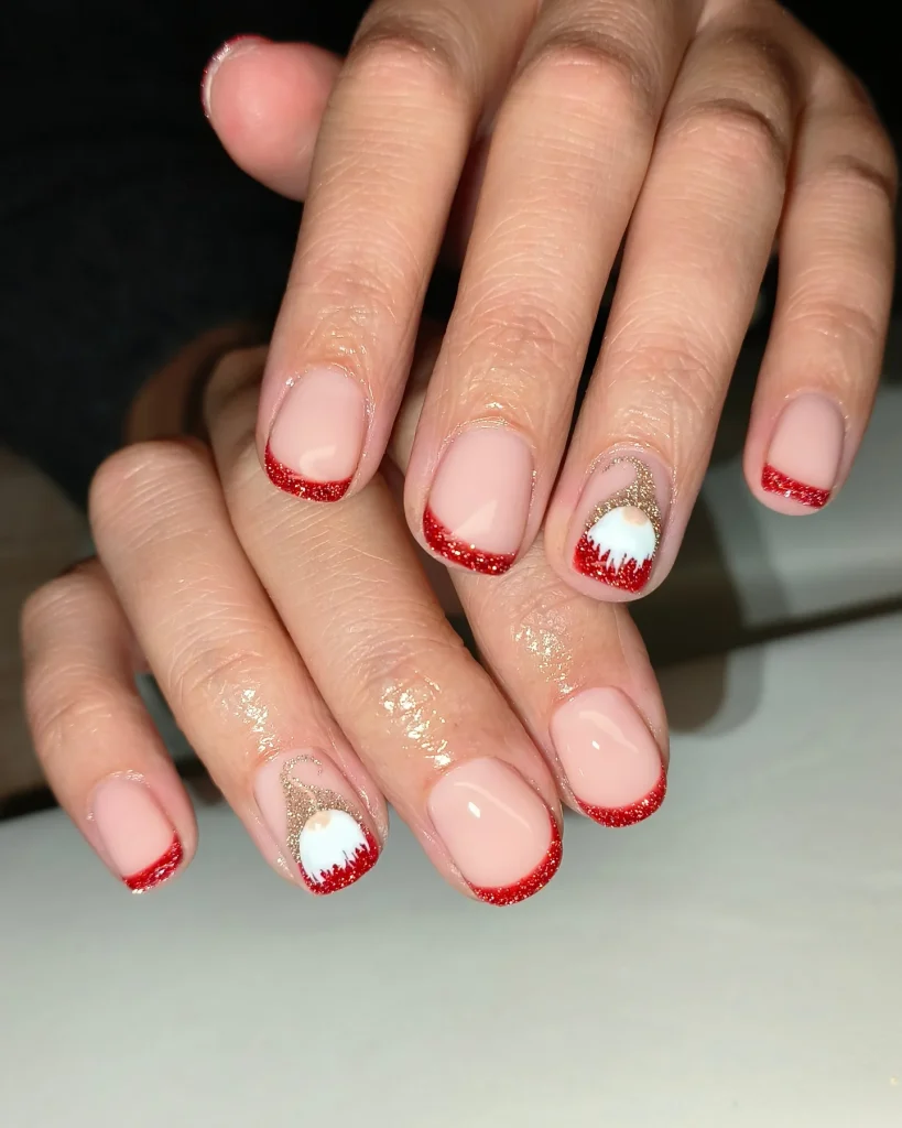Festive red glitter French manicure with Santa Claus design on short nails. Holiday-themed nail art.