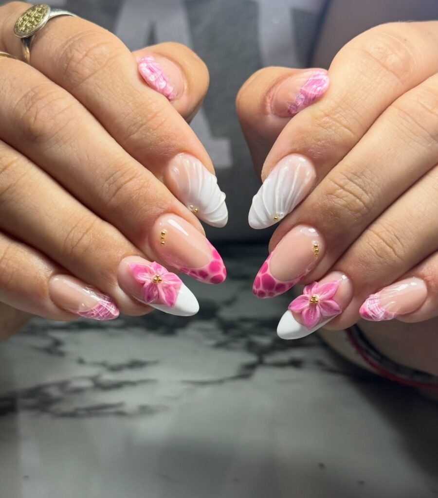 Elegant pink and white floral nail art with 3D flowers, perfect for showcasing creative manicure designs.