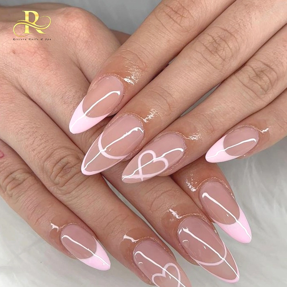 Elegant pink and white almond-shaped nails with heart design for a stylish manicure.